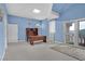 Comfortable office with a built-in desk, blue walls, and access to a patio at 3372 Westwind Rd, Las Vegas, NV 89146
