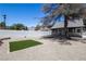 This backyard offers a low-maintenance landscape with gravel, artificial turf, and a covered patio, ideal for easy living at 363 El Pico Dr, Henderson, NV 89014