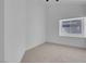 Bright bedroom with plush carpeting and natural light from the window at 363 El Pico Dr, Henderson, NV 89014
