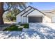 Charming single-Gathering home with a manicured front yard and a two-car garage on a sunny day at 363 El Pico Dr, Henderson, NV 89014