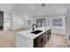 Open-concept kitchen features an island, stainless steel appliances, and hardwood floors at 363 El Pico Dr, Henderson, NV 89014