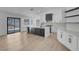 Modern kitchen with an island, stainless steel appliances, and hardwood floors at 363 El Pico Dr, Henderson, NV 89014