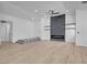 Spacious living room with a modern fireplace, recessed lighting, and hardwood floors at 363 El Pico Dr, Henderson, NV 89014