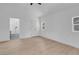 Bright main bedroom with light wood floors, neutral walls, and ensuite bath at 363 El Pico Dr, Henderson, NV 89014