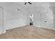Spacious main bedroom with light wood floors, neutral walls, and a view into the bathroom at 363 El Pico Dr, Henderson, NV 89014