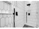 Contemporary shower featuring eye-catching tile work and sleek, modern fixtures at 363 El Pico Dr, Henderson, NV 89014