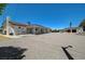 Expansive backyard featuring a large gravel area with patio, detached garage, and endless possibilities at 3917 Leon Ave, Las Vegas, NV 89130