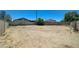 Vacant backyard area with dirt and some vegetation, providing a blank canvas for creating an outdoor space at 3917 Leon Ave, Las Vegas, NV 89130