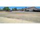 Large gravel and dirt backyard with a covered patio, hot tub, and space for entertaining at 3917 Leon Ave, Las Vegas, NV 89130