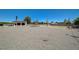 Large gravel backyard with detached garage, offering ample space and potential for various activities at 3917 Leon Ave, Las Vegas, NV 89130