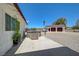 Backyard showing a hot tub, concrete patio area, and detached garage, providing many recreation options at 3917 Leon Ave, Las Vegas, NV 89130