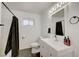 Modern bathroom features a large vanity, sleek fixtures, and a shower-tub combination at 3917 Leon Ave, Las Vegas, NV 89130