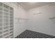 Organized walk-in closet with built-in shelving and a stylish black and white floor at 3917 Leon Ave, Las Vegas, NV 89130