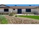 Charming single-story home with a low-maintenance rock and turf yard and a secured front door at 3917 Leon Ave, Las Vegas, NV 89130
