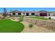 Attractive single-story home with unique desert landscaping and a well-maintained lawn at 3917 Leon Ave, Las Vegas, NV 89130