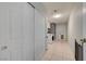 Hallway leading to laundry room with adjacent closet for ample storage at 3917 Leon Ave, Las Vegas, NV 89130