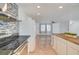 Modern kitchen with stainless appliances, center island, and breakfast bar at 3917 Leon Ave, Las Vegas, NV 89130