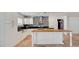 Bright kitchen with white cabinets, stainless steel appliances, and a large island at 3917 Leon Ave, Las Vegas, NV 89130
