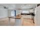 Open kitchen with a spacious island and stainless steel appliances with a view to the living room at 3917 Leon Ave, Las Vegas, NV 89130