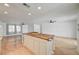 Spacious kitchen featuring a large island with a wooden countertop and white cabinets at 3917 Leon Ave, Las Vegas, NV 89130