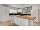 Kitchen featuring white cabinets, stainless steel appliances, and a large island at 3917 Leon Ave, Las Vegas, NV 89130