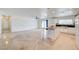 Open-concept living room with a view of the kitchen and large windows at 3917 Leon Ave, Las Vegas, NV 89130