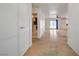 Bright, open living room with neutral walls, stained concrete floors, and sliding glass doors to the backyard at 3917 Leon Ave, Las Vegas, NV 89130
