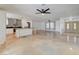 Expansive open-concept living area featuring a ceiling fan and views of the kitchen and entry at 3917 Leon Ave, Las Vegas, NV 89130