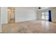 Open living area with sleek floors, white walls, and access to the backyard through sliding glass doors at 3917 Leon Ave, Las Vegas, NV 89130