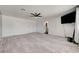 Bright living room featuring modern wood-look floors, a ceiling fan, and neutral decor at 3917 Leon Ave, Las Vegas, NV 89130