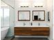 Modern bathroom featuring a double sink vanity with wood cabinets and a separate glass-enclosed shower at 3934 Sangre De Cristo Ave, Las Vegas, NV 89118