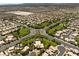 Expansive aerial view of a residential community with lush green spaces and meticulously planned neighborhood streets at 4212 Helens Pouroff Ave, North Las Vegas, NV 89085