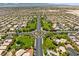 Community aerial view showcasing well-maintained streets, lush landscaping, and a central roundabout at 4212 Helens Pouroff Ave, North Las Vegas, NV 89085