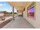 Spacious back patio with concrete flooring, ceiling fans, and outdoor built-in BBQ, ideal for backyard gatherings at 4212 Helens Pouroff Ave, North Las Vegas, NV 89085