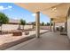 Back patio featuring a built-in outdoor kitchen area and an outdoor ceiling fan, perfect for entertaining guests at 4212 Helens Pouroff Ave, North Las Vegas, NV 89085