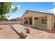 The backyard has a covered patio with ceiling fans, offering a comfortable space to enjoy outdoor living and entertaining at 4212 Helens Pouroff Ave, North Las Vegas, NV 89085