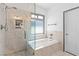Modern bathroom with glass enclosed shower, soaker tub, and a stylish design at 4212 Helens Pouroff Ave, North Las Vegas, NV 89085