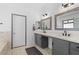 Elegant bathroom offers a double sink vanity, and a separate tub and shower for a spa-like experience at 4212 Helens Pouroff Ave, North Las Vegas, NV 89085