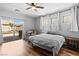Cozy bedroom boasts a sliding glass door to the backyard patio for relaxation and enjoyment at 4212 Helens Pouroff Ave, North Las Vegas, NV 89085