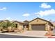 Charming single-story home featuring a two-car garage, well-maintained landscaping, and a welcoming entrance at 4212 Helens Pouroff Ave, North Las Vegas, NV 89085