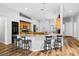 Spacious kitchen with granite countertops, wood cabinets and stools at breakfast bar at 4212 Helens Pouroff Ave, North Las Vegas, NV 89085
