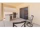 Covered patio featuring a built-in grill area and convenient access to indoor spaces at 4212 Helens Pouroff Ave, North Las Vegas, NV 89085