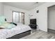 Bedroom with sliding glass door and security bars for extra protection and natural lighting at 4232 Park Ct, Las Vegas, NV 89110