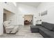 Bright living room showcasing open layout, hardwood-style floors, and comfortable furnishings at 4232 Park Ct, Las Vegas, NV 89110