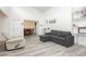 Comfortable living area with a gray sofa, recliner, and a view of the dining room at 4232 Park Ct, Las Vegas, NV 89110