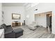 Open living room with neutral tones, modern furniture, and bright natural light at 4232 Park Ct, Las Vegas, NV 89110