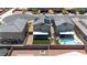 Aerial view of home exteriors and backyards, including covered patios, pools, and well-kept landscaping, all contained by privacy walls at 438 Shimmering Sands Ave, North Las Vegas, NV 89031