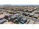 Expansive aerial view of a residential neighborhood showcasing uniform homes and community layout with mountain views in the background at 438 Shimmering Sands Ave, North Las Vegas, NV 89031