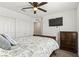 Cozy bedroom with a full-size bed, flat-screen TV, dresser, and carpet flooring at 438 Shimmering Sands Ave, North Las Vegas, NV 89031