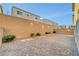 Backyard area features paver patio, block wall for privacy, and desert landscaping at 4641 Therapeutic St, North Las Vegas, NV 89031